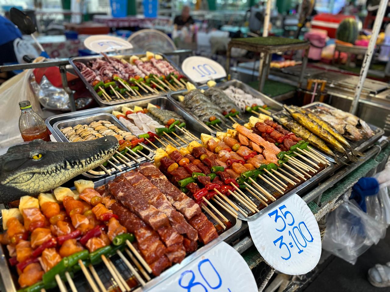 Skewers and fresh seafood on a Southeast Asian night market grill