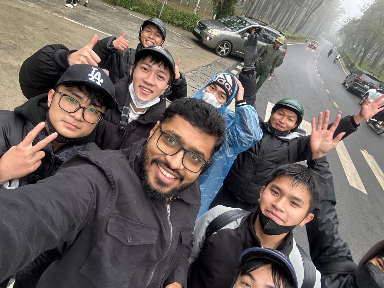 A Mighosh group of travellers on a foggy mountain road in northern Vietnam